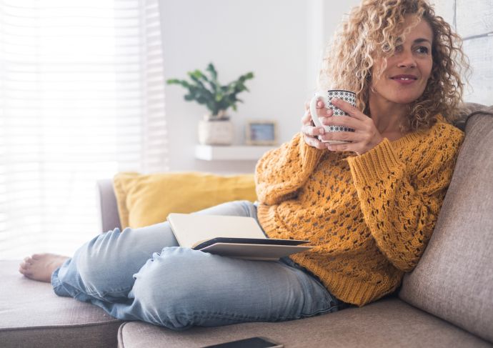 Woman on Couch with Coffee