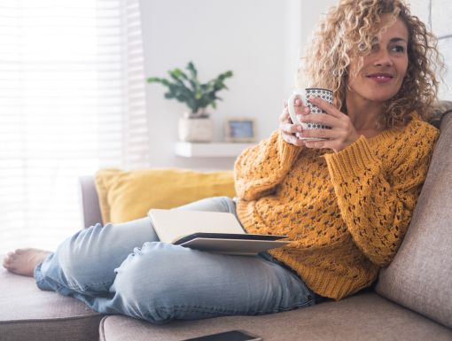 Woman on Couch with Coffee