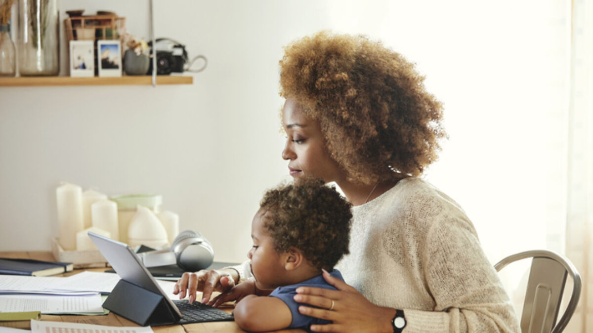 Mom looking at computer with Child