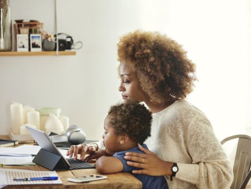 Mom looking at computer with Child