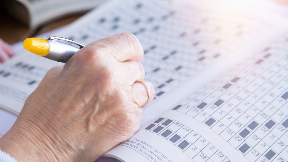 Senior woman doing crossword puzzles