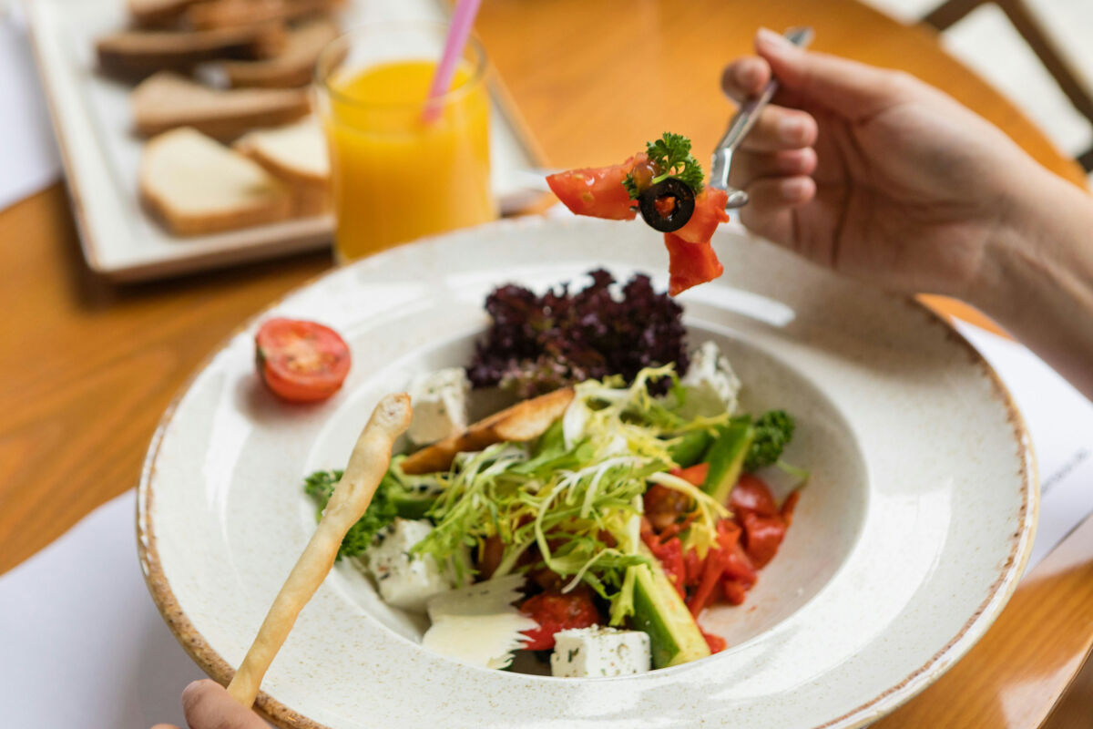 Person eating salad
