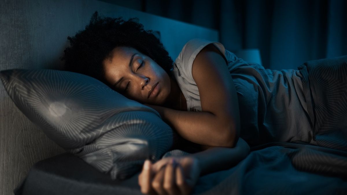 Woman sleeping in her bed