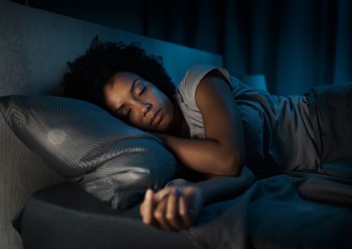 Woman sleeping in her bed