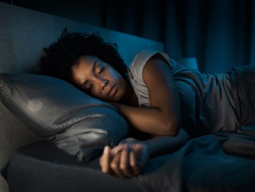 Woman sleeping in her bed
