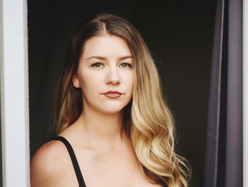 Young woman wearing tank top looking serious