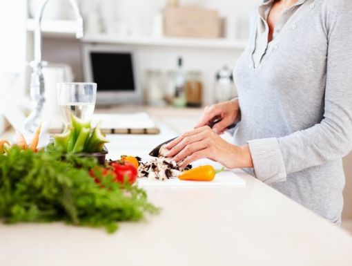 Women cutting up food