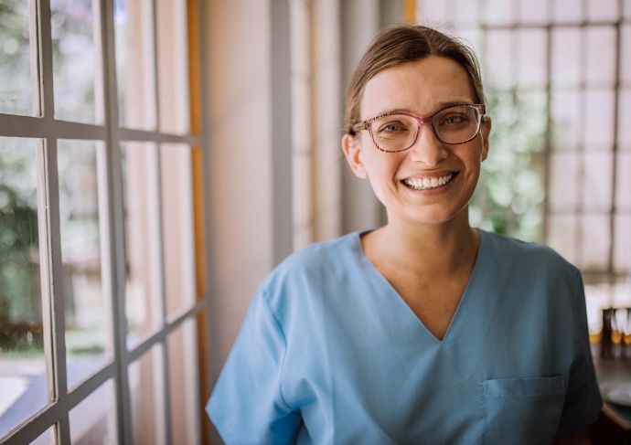 Happy nurse in scrubs