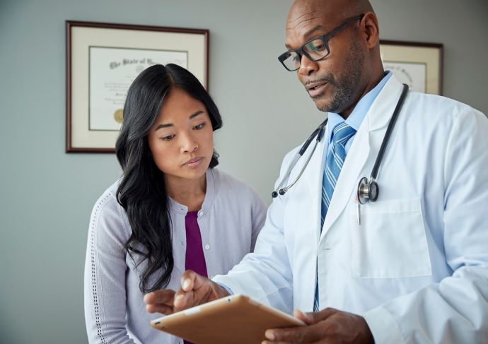 Doctor and patient review medical results