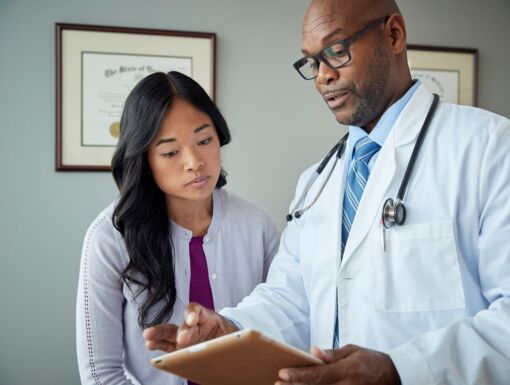 Doctor and patient review medical results