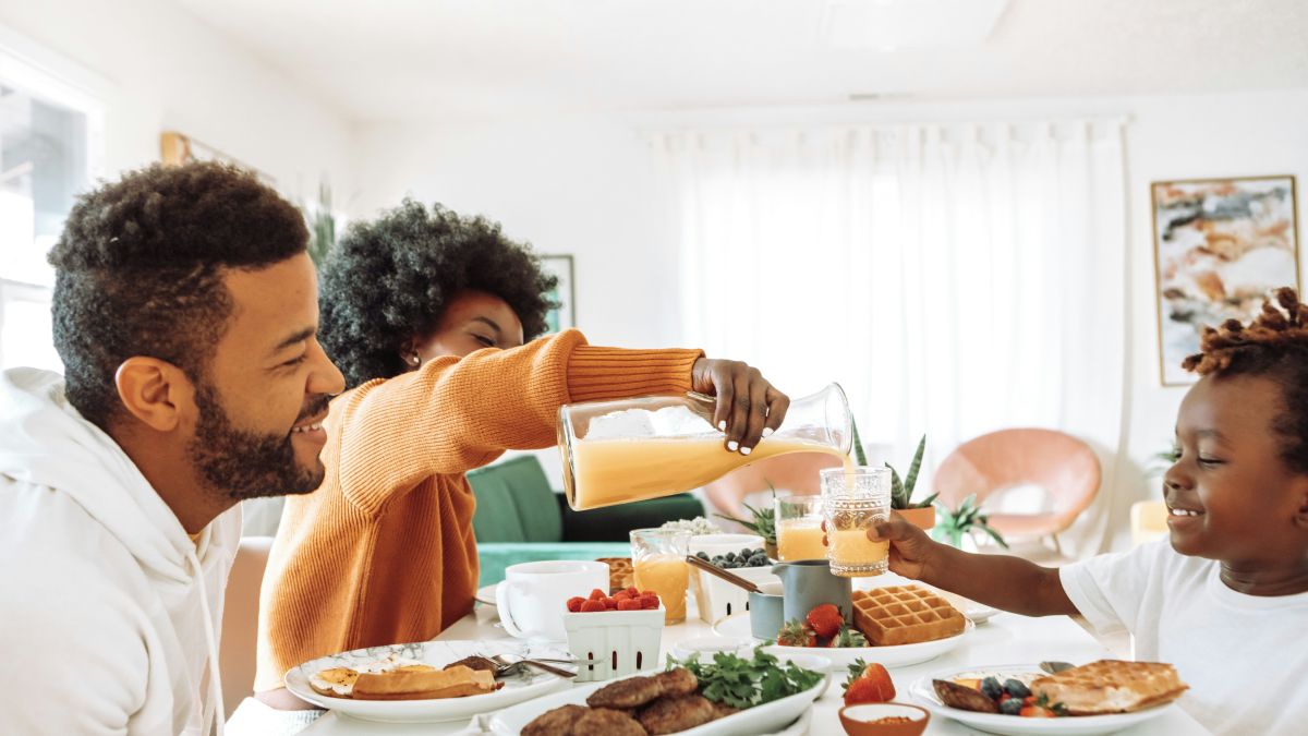 Family of three eating breakfast
