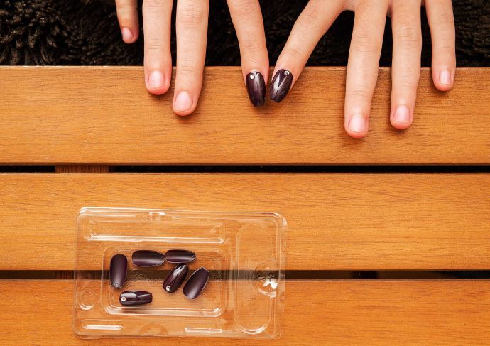 Woman applying press on nails 1