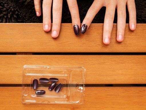 Woman applying press on nails 1