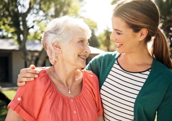 Daughter and older mother looking at eachother