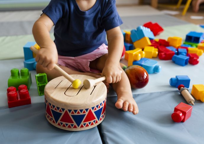 Child with Blocks and Music