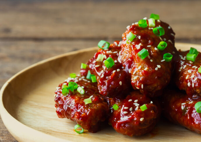 Korean BBQ Chicken Wings sprinkled with sesame and spring onion
