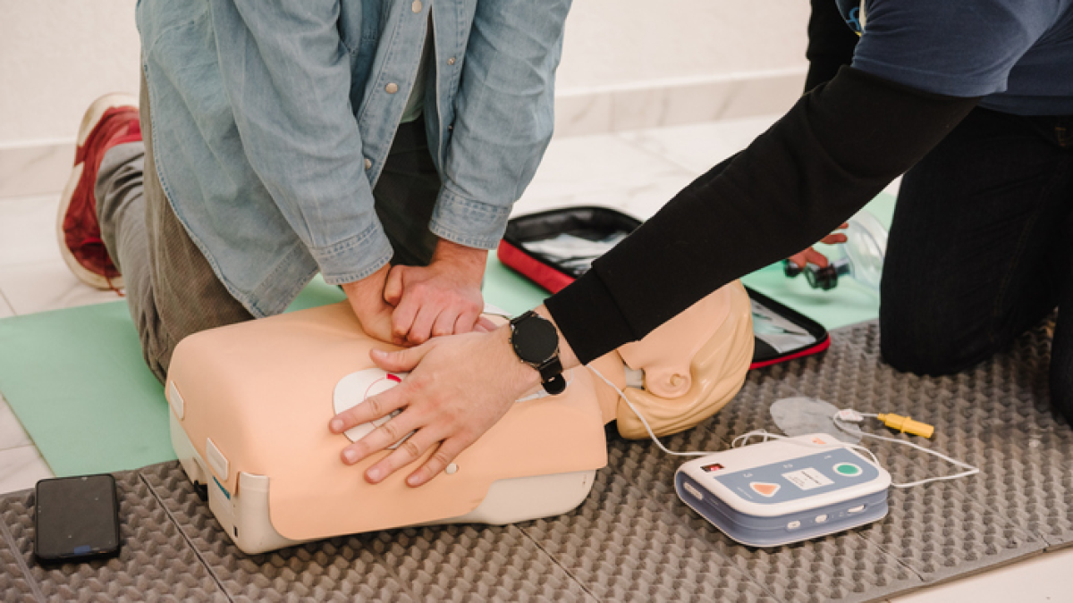 Instructor and person in CPR class
