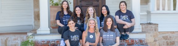 Eat Fit team sitting together on front step