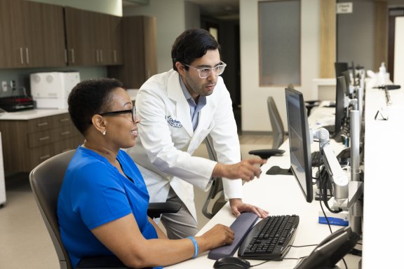 Doctor and nurse looking at computer screen