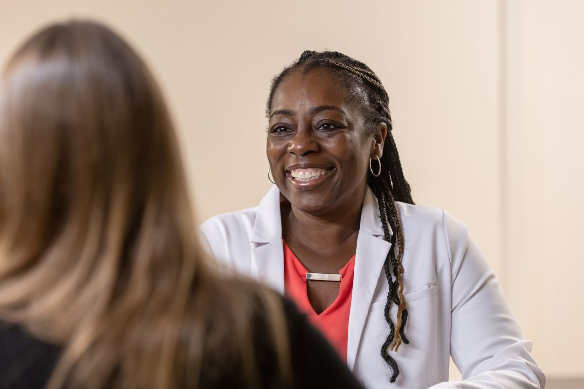 doctor smiling and talking with patient