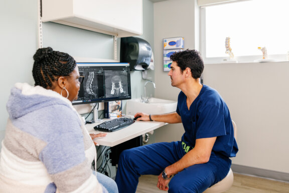 doctor and patient reviewing medical records