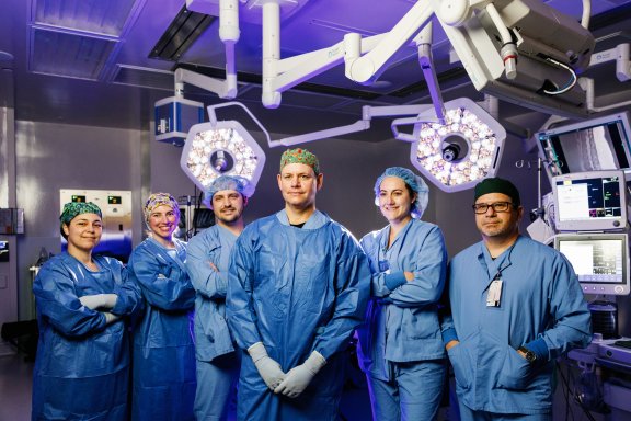 surgery team standing in operating room