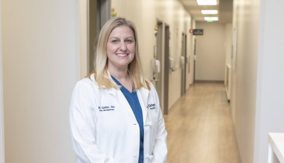 Female doctor standing in hall