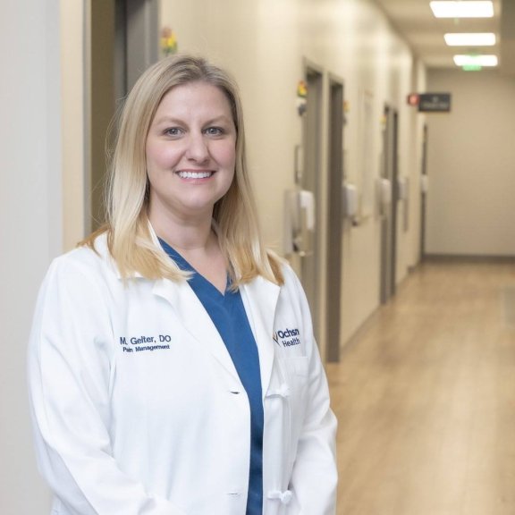 Female doctor standing in hall