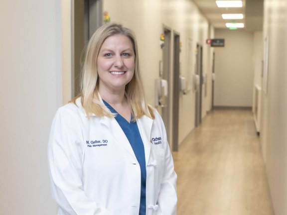 Female doctor standing in hall