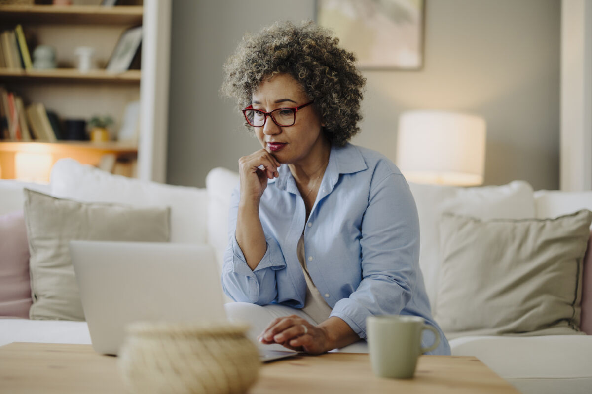 Woman on computer smiling
