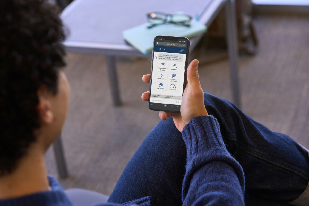 Male patient looking at phone
