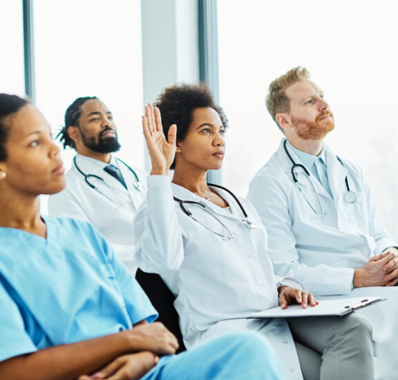 Healthcare employees in class for education