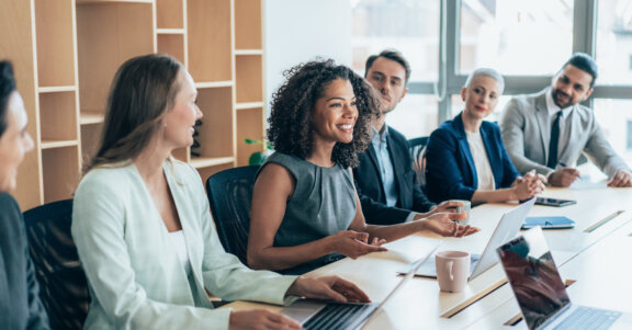 Employer leading conference room meeting