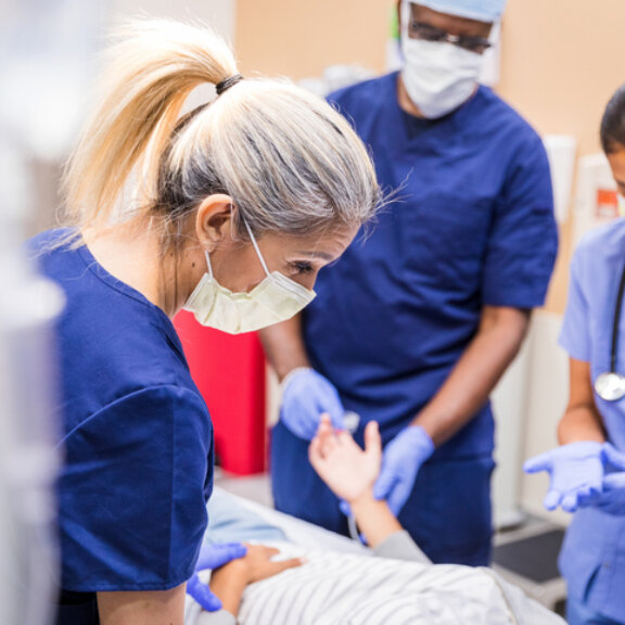 Transplant care team treating patient