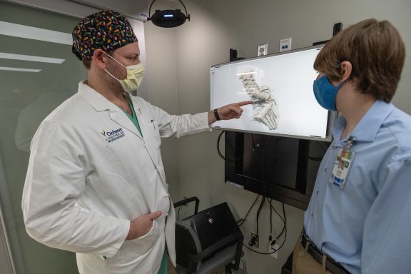 doctor reviewing virtual model of spine