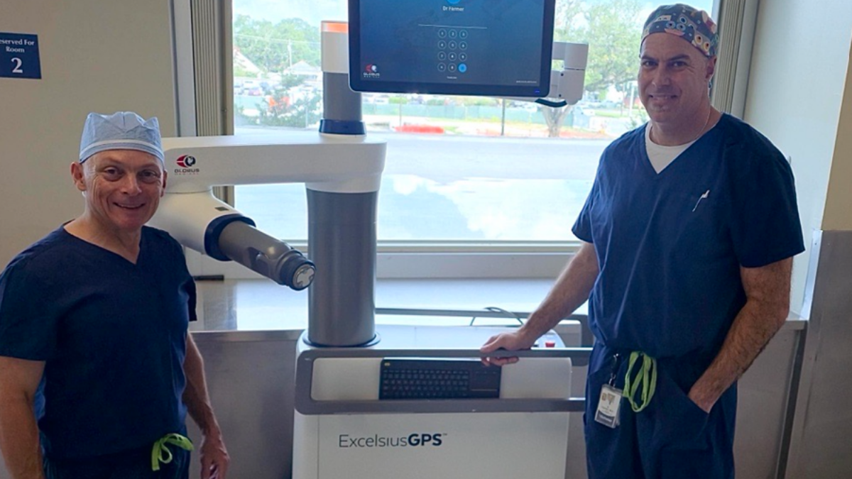 Drs Farmer and Haber with robot