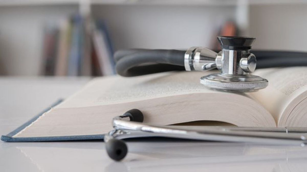 a stethoscope and a book