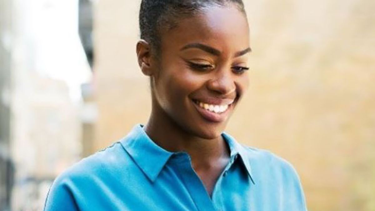 Employee on phone who is an Ochsner Brand Ambassador