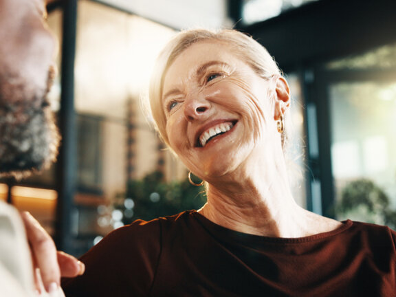 Woman looking at man and smiling