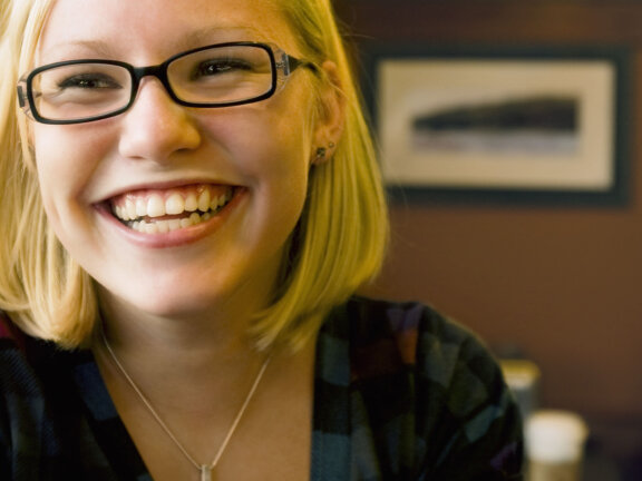 Smiling woman in glasses