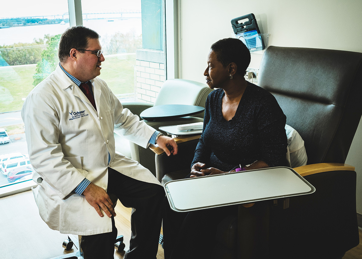 Marc Matrana, MD, speaking to a patient