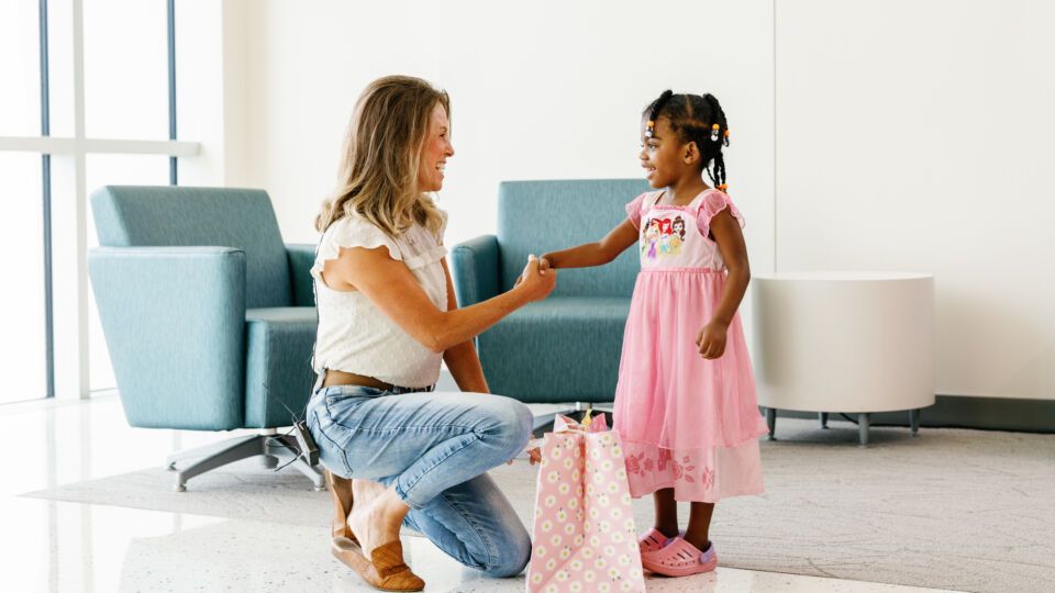 Living liver donor and living liver recipient shaking hands for the first time.