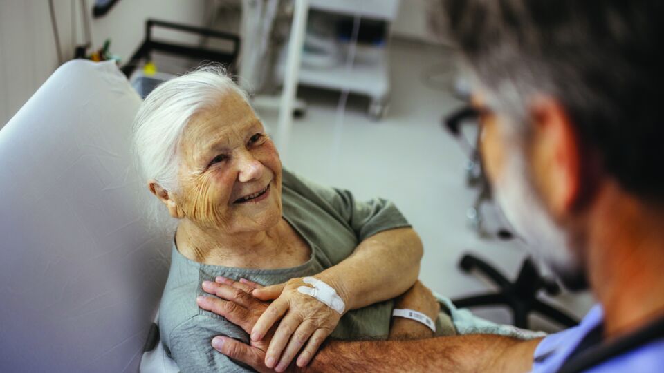 Getty Images senior patient looking up at a provider