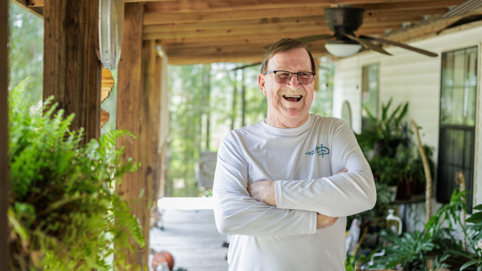 lymphoma patient smiling on porch