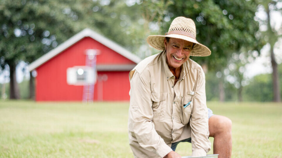 LVAD patient outside in the yard smiling