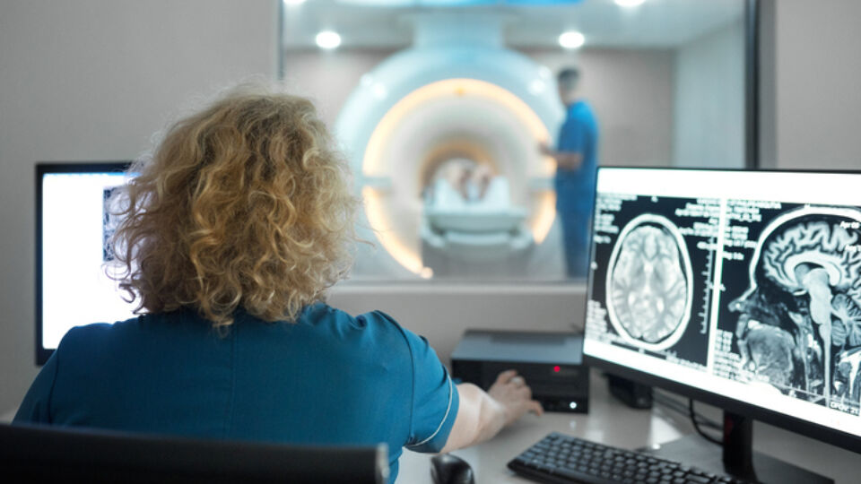 Ct technologist performing exam