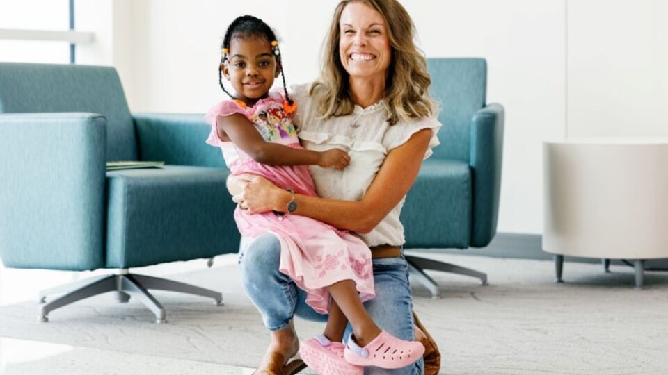 Pediatric liver transplant patient hugging her non direct liver donor